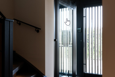 View of a closed lift and a staircase up and down and a passage