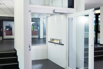 View of a closed lift and a staircase up and down and a passage View of a closed lift and a staircase up and down and a passage